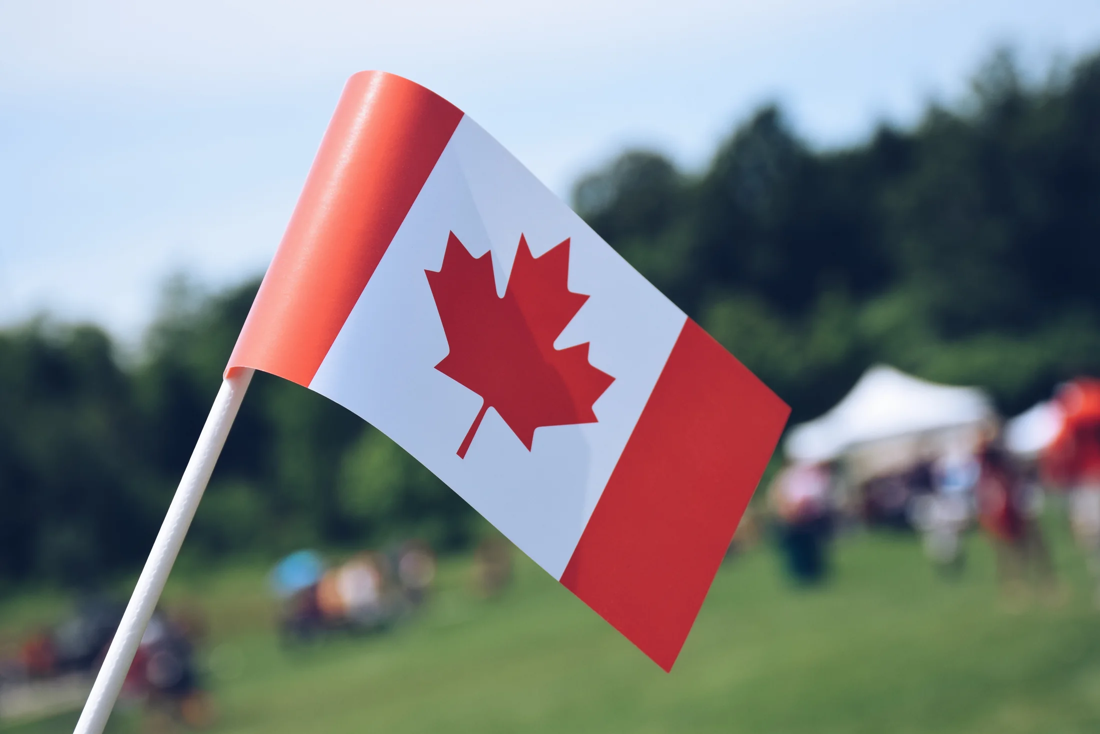 Canadian flag celebrating immigration opportunities and community in Canada